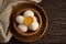 Fresh eggs in a plate on uncooked traditional   healthy a wooden background kitchen