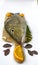 Fresh Emperor Fish decorated with herbs and vegetables on a wooden pad.White Background