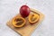 Fresh Exotic Fruit Tamarillo Sliced On Wooded Cutting Board On Table. Egg-shaped Edible