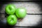 Fresh farm raised apples on rustic wooden background