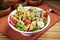 Fresh Fattoush Salad with tomato, cucumber and green leaf served in bowl isolated on table side view of middle east food