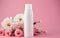 Fresh feminine beauty concept. White cosmetic bottle mock up on soft pink background with flowers bouquet. AI Generative