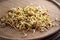 Fresh fenugreek sprouts on a wooden table