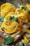 Fresh fettuccine pasta nests garnished with basil on a rustic wooden board.