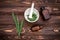 Fresh Field horsetail in a pharmacy mortar with a pestle on a wooden table. Collection of medicinal herbs for homeopathy and