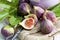 Fresh figs, Ficus carica, old knife on sackcloth