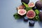 Fresh figs with mint and blueberries. Beautifulf berry, fruit background, frame for design with copy space