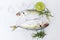 Fresh fish raw Yellow-stripe scad with lemon, Mackerel fish on ice for cooking food in the restaurant, top view