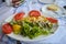 Fresh fish-sword with vegetables on a white plate