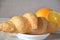 Fresh flaky croissants, assorted orange