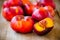 Fresh flat nectarines on a wooden background