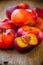 Fresh flat nectarines on a wooden background