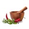 Fresh flavoring herbs and spices in wooden mortar