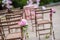 Fresh flower chair decoration for an outdoor wedding ceremony