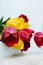 Fresh flowers in the home interior. lush tulips red and yellow on window background in apartment. Spring Awakening. selective