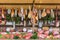 Fresh food market background with raw pork and vertical assorted salami sausages.