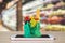 Fresh food and vegetables in green shopping bag on mobile smartphone on wood table with supermarket aisle