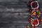 Fresh forest berries in bowls on a wooden background. Top view