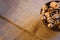 Fresh forest mushrooms in a bowl standing on a table with sackcloth