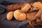 Fresh fragrant bread on the table. Food concept. Bakery, crusty loaves of bread and buns. Assortment of baked bread