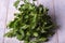 Fresh frizzy parsley on a wooden table