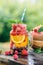 Fresh fruit and berry water in glass jar.