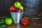 .Fresh fruit, green apple and red apple in a bucket