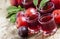 Fresh fruit juice of red plums and peaches, selective focus