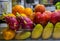 Fresh fruit mango, pomegranate, orange, apples, oranges and dragon fruit at a juice stand in a hawker center, Singapore