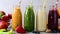 Fresh fruit and vegetable smoothies bottles with straws. Healthy detox drinks