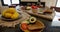 Fresh fruit, vegetables, bread, and more on shiny black table