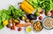 Fresh fruit and vegetables, grains, and nuts on a white background.