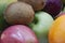 Fresh Fruits Background. Close Up Of Plums, Orange, Mango, Apples And Kiwifruit