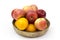 Fresh fruits in a clay bowl - oranges and apples