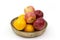 Fresh fruits in a clay bowl - oranges and apples