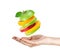 Fresh fruits. Hand and flying mixed fruits on white