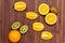 Fresh fruits kiwi, orange isolated on wooden background. Healthy food. A mix of fresh fruit. Group of citrus fruits. Vegetarian.