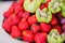 Fresh fruits on plate. Strawberries, kiwi, grapes on catering banquet table.