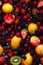 Fresh fruits seamless background, adorned with glistening droplets of water. Generative AI