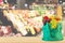 Fresh fruits and vegetables in shopping bag on wood table top with supermarket