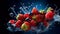 Fresh fruits with water splash on dark blue background. Healthy food concept. Falling strawberries and blackberries in water
