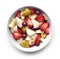 Fresh fruits in a white bowl, breakfast scene