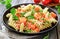 Fresh Fusilli Pasta Salad With Smoked Salmon and Basil on a Rustic Wooden Background