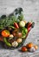 Fresh garden vegetables - broccoli, zucchini, eggplant, peppers, beets, tomatoes, onions, garlic - vintage metal basket