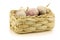 Fresh garlic bulbs in a woven basket