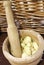 Fresh garlic in the pestle to prepare a great dish of Italian an