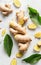 Fresh Ginger Root With Green Leaves on a White Background