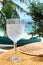 Fresh glass of water on a table, tropical beach
