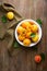 Fresh golden apricot on wooden table