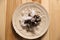 Fresh goose barnacle with ice on table, top view